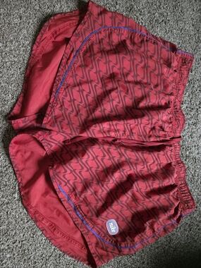 Nike Women's Red Patterned Athletic Shorts with Blue Trim